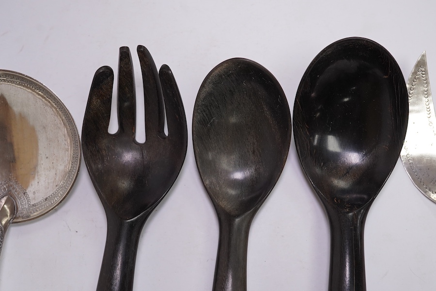 A pair of Malaysian/Indonesian white metal salad servers, fork 25.7cm and three other similar white metal handle horn servers. Condition - fair to good